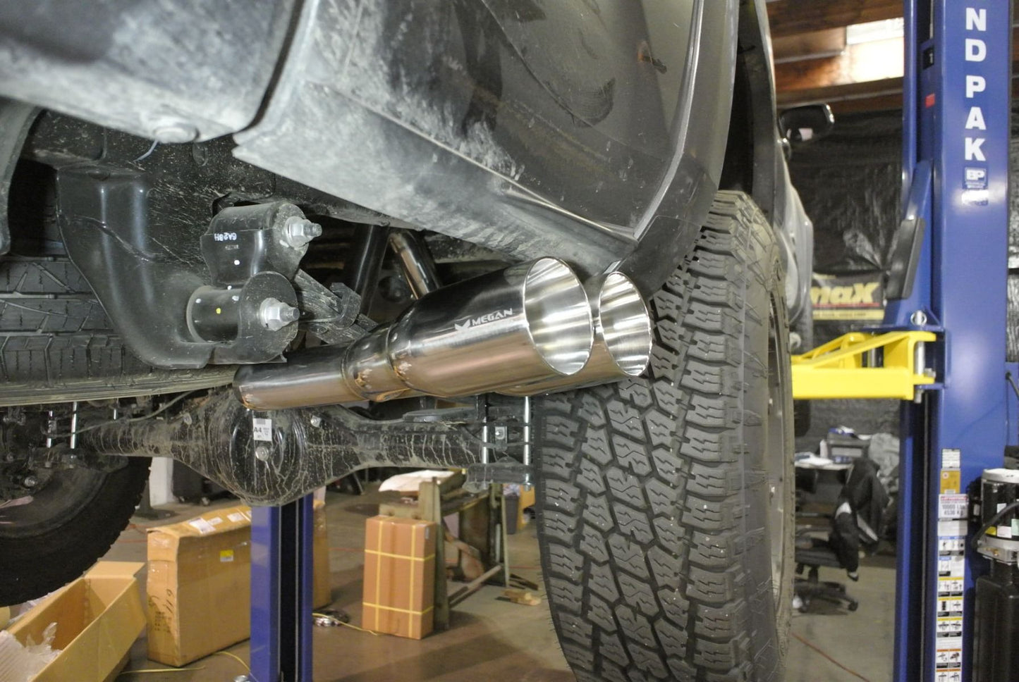 Megan Racing OE-RS Series Cat-Back Exhaust System Twin Round Tips For 16-23 Toyota Tacoma N300